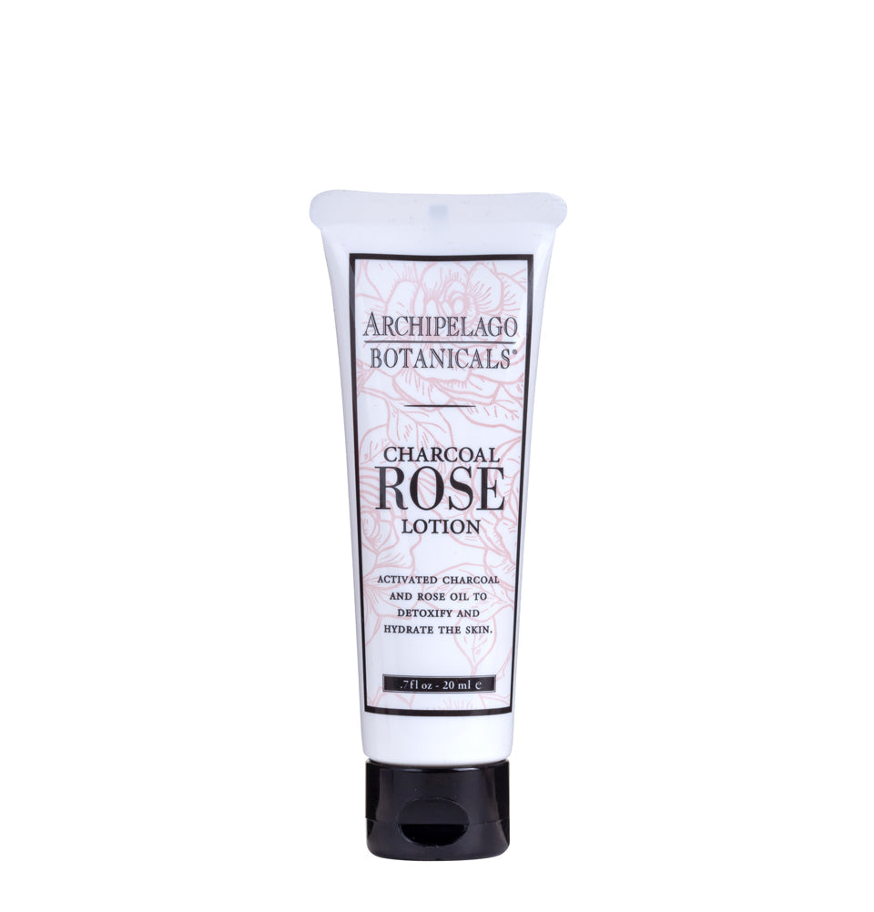 Charcoal Rose lotion bottle with black cassis and pressed rose fragrance