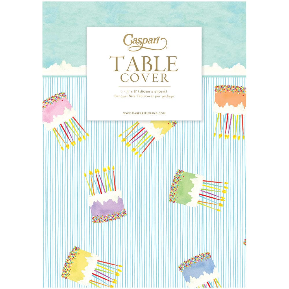 Caspari Cake Frosting paper linen table cover with birthday cake and candle pattern.