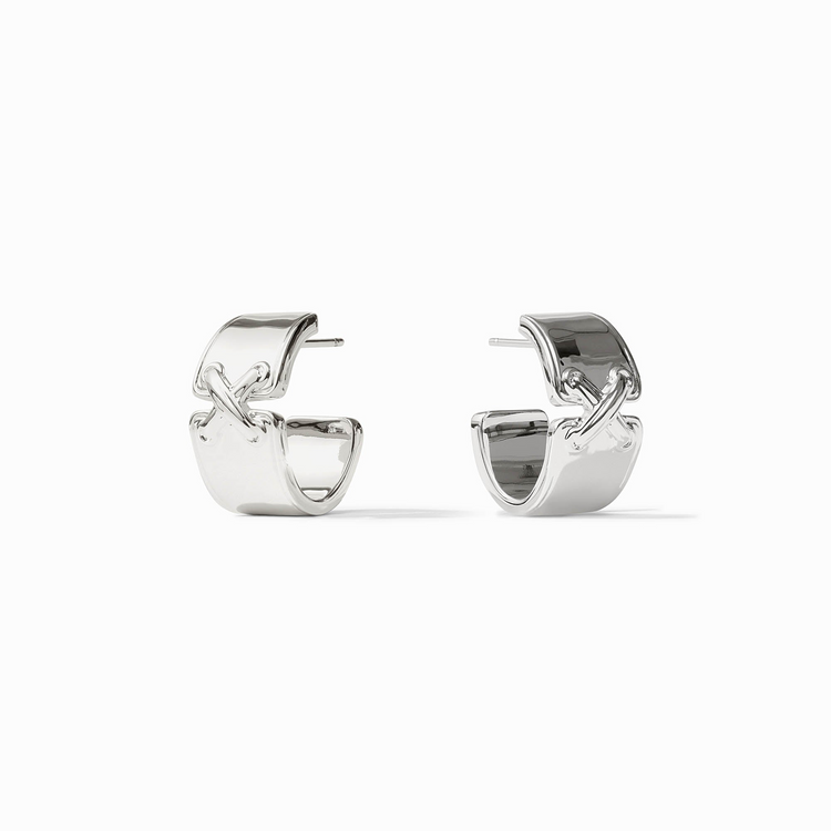 A pair of silver-plated Essex Hoop earrings with a wide band and a decorative cross detail.