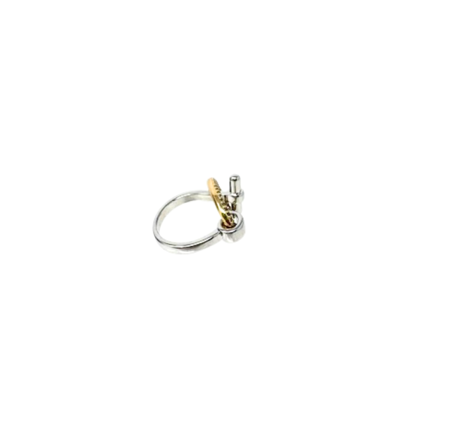Silver chunky band fashion statement ring with a gold-toned circular accent and toggle detail.