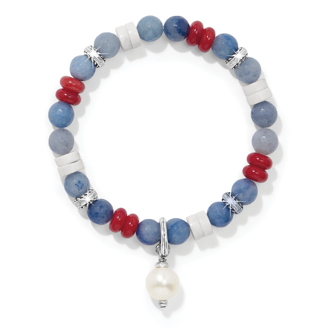 Silver stretch bracelet with white freshwater pearl and red, white, blue Americana charms.
