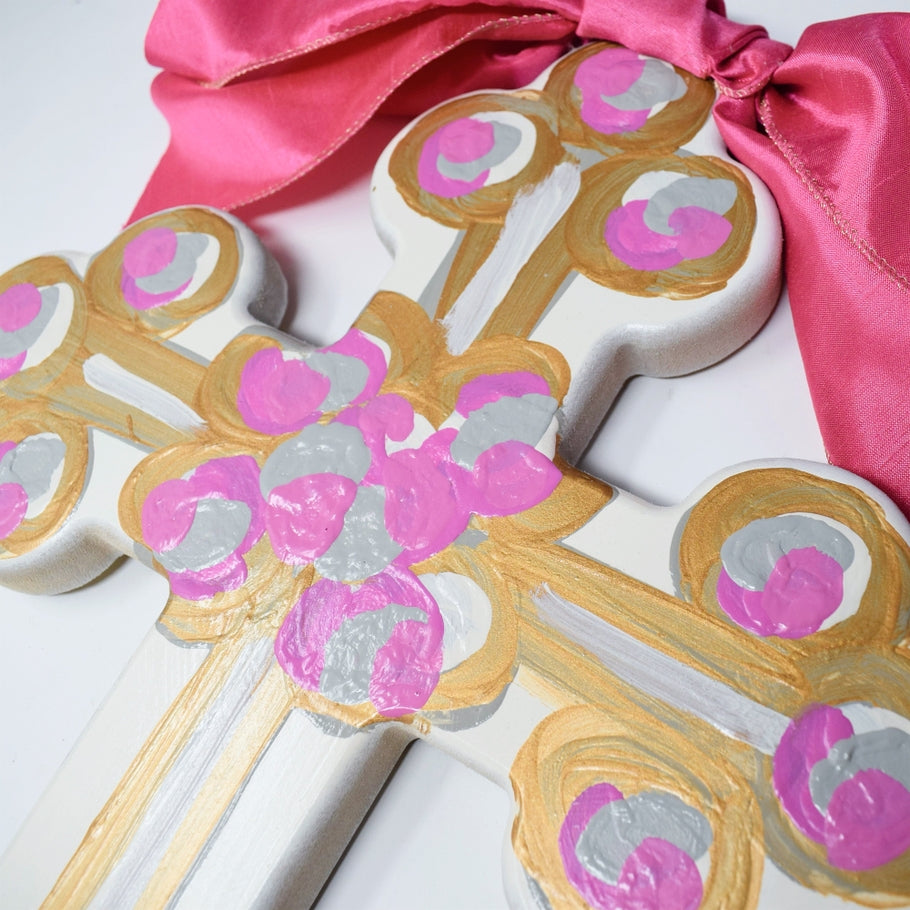 Hand-painted MDF cross with a satin bow top, gold back paint, artist signature, and slight design variations.