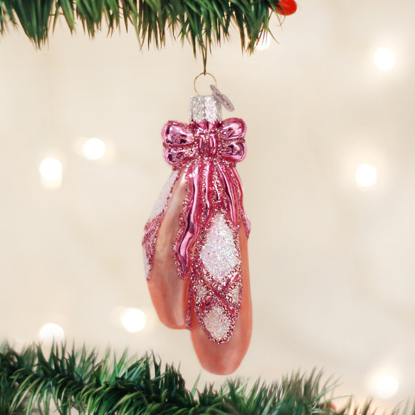Ballet toe shoes ornament shaped like a Sugar Plum Fairy in silver metallic finish with pink accents.