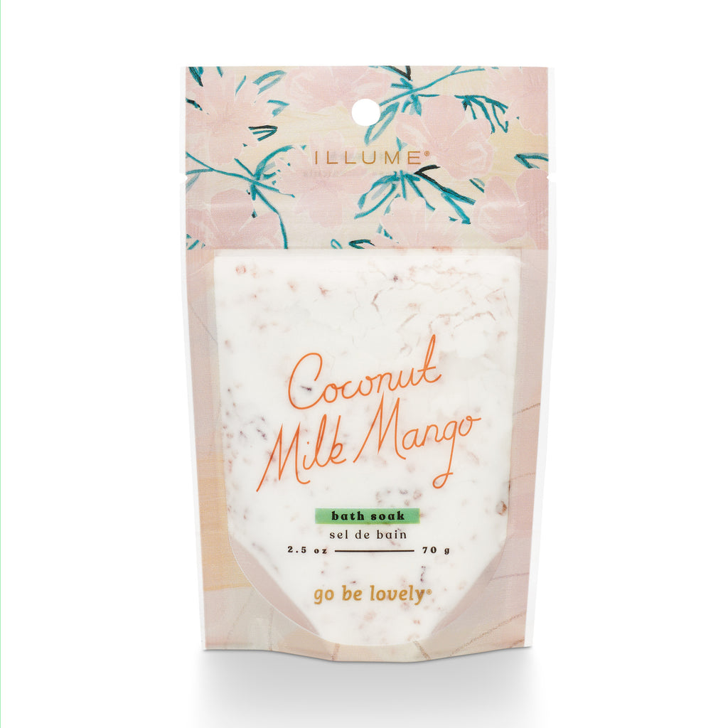 Illume Coconut Milk Mango bath soak in a 2.5 oz floral-patterned packet.