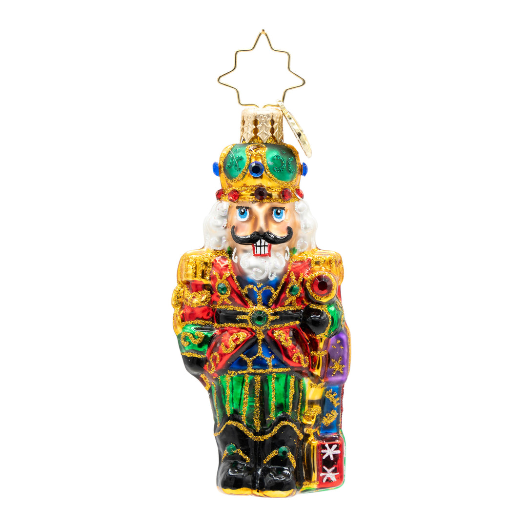 Colorful glass nutcracker Christmas ornament with gold glitter accents and a star-shaped hanger.