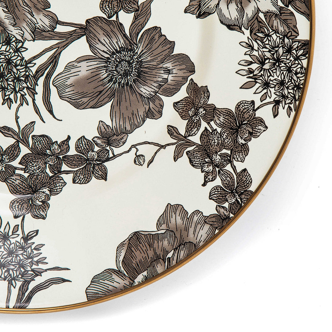 Close-up of a Sterling English Garden Enamel Dinner Plate with black and white floral patterns.