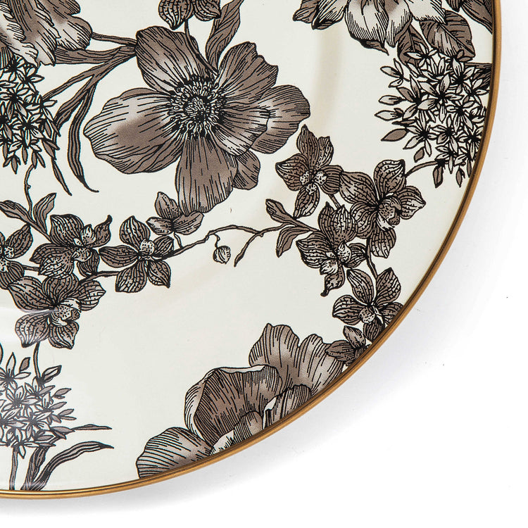 Close-up of a Sterling English Garden Enamel Dinner Plate with black and white floral patterns.