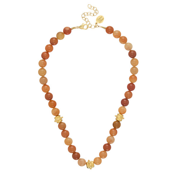 Bailey Necklace featuring orange and brown stone beads with three gold accents and a lobster clasp.