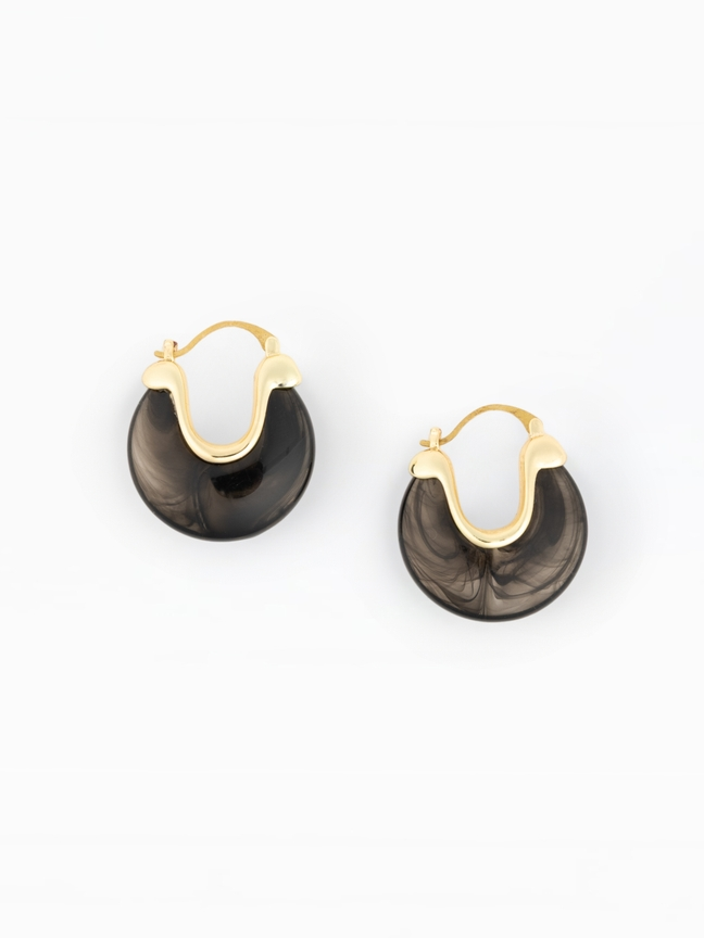 Mabel Earrings featuring a gold-plated brass frame with a smoky black marbled resin hoop.