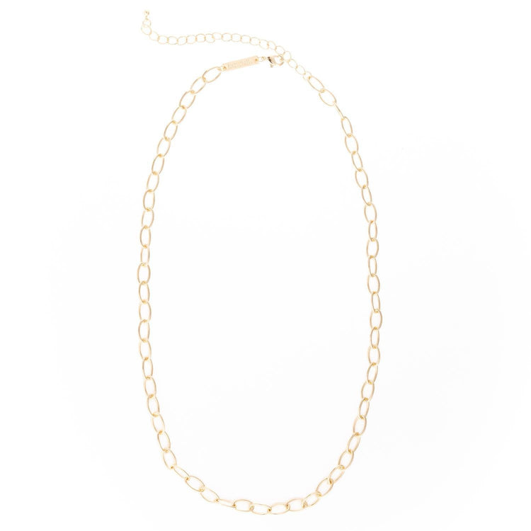 Gold-plated chain necklace with a small pendant on an extender.