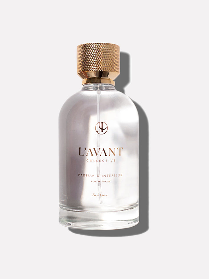 Glass bottle of Fresh Linen Room Spray with a pump dispenser.