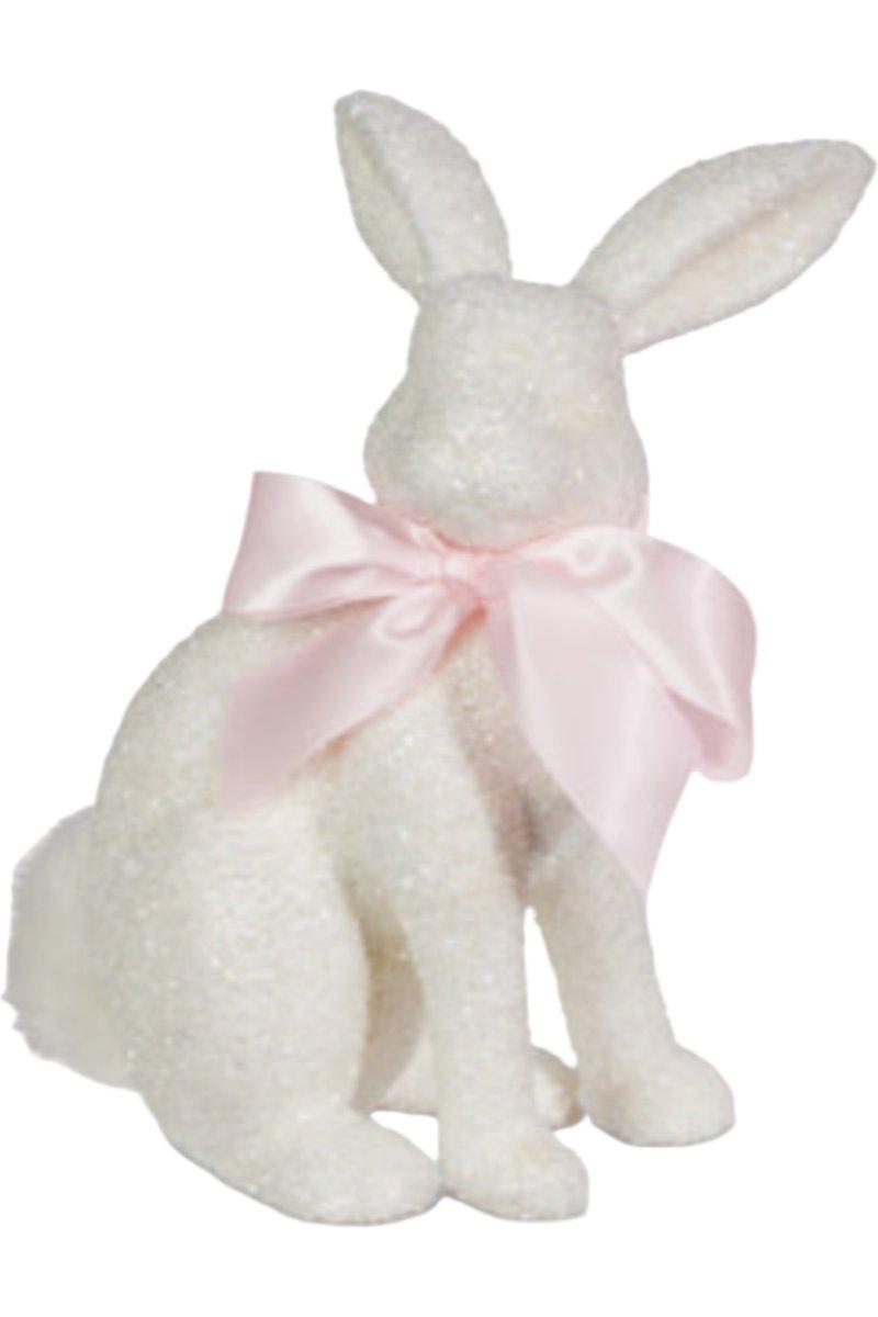 White glitter bunny figurine made of plastic with polyester fur measuring 6.5 inches long.