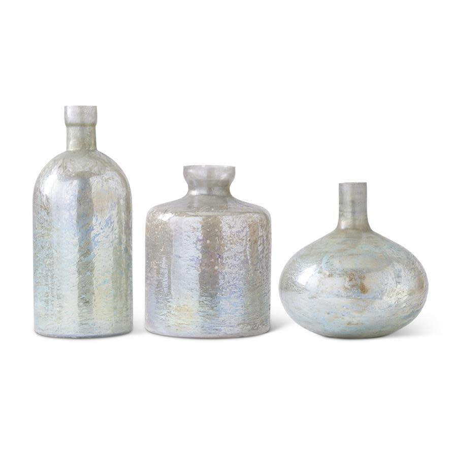 Antique matte glass bottle vase in light green with a cylindrical silhouette.