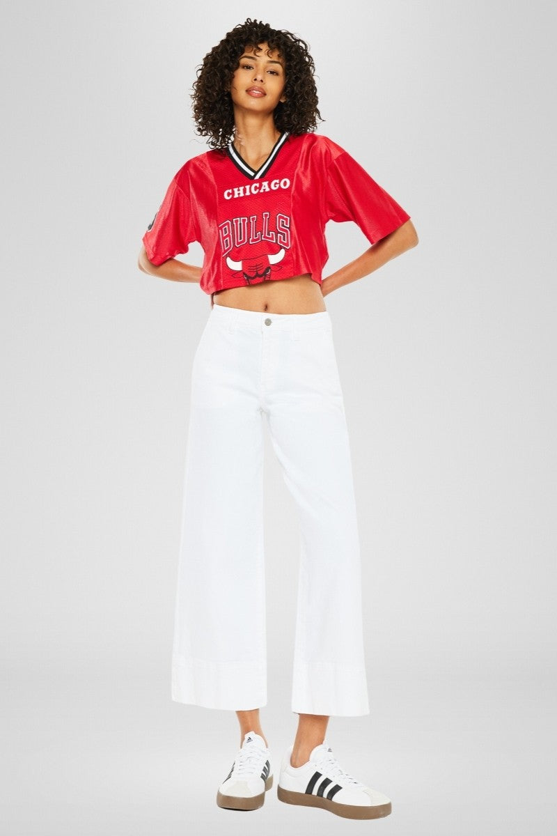 Front view of Patricia high-rise wide-leg cropped jeans in dark denim with slant pockets and zipper fly.