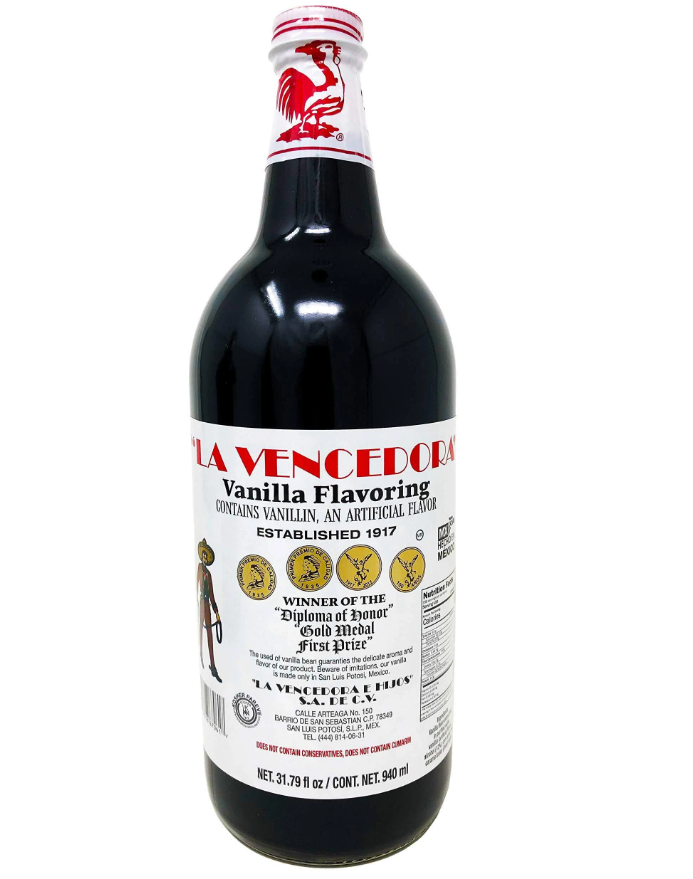 940 ml bottle of La Vencedora Vanilla Flavoring with a white label and red rooster logo on the neck.