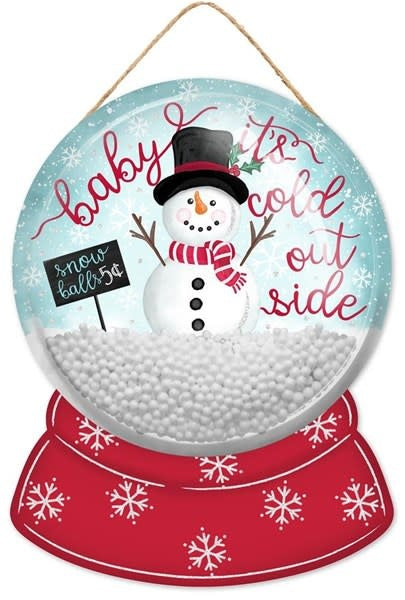 Red glitter globe dome sign with black text reading 'Baby It's Cold' on a white background.