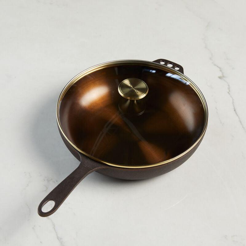 No. 11 Deep Skillet with a polished interior, cast iron handle, and tempered glass lid.
