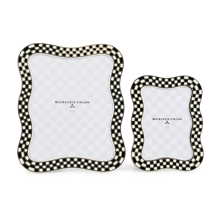 Two wavy silver-plated picture frames with black and white checkered enamel borders.