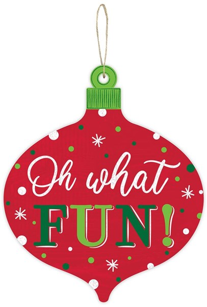 Red ornament-shaped sign with white polka dots, snowflakes, and the text Oh what FUN!