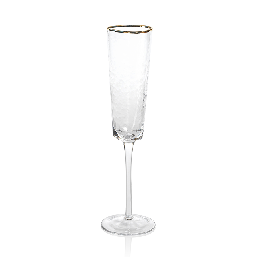 Clear triangular champagne flute with a gold rim on the edge