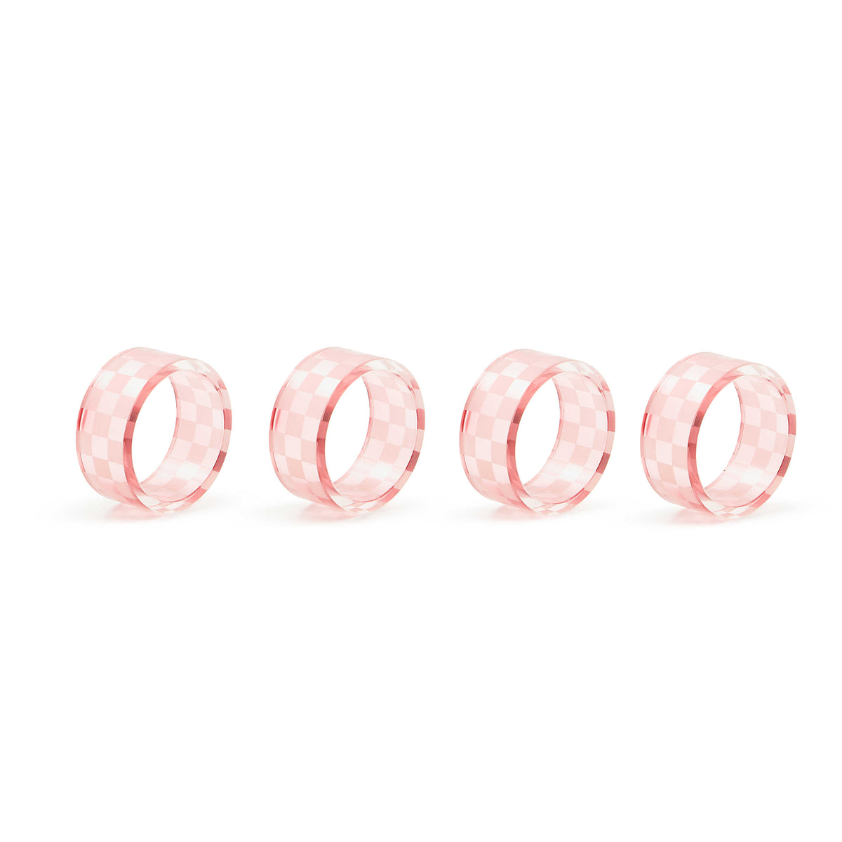Set of four pink glass napkin rings with a checkered pattern on a white background.
