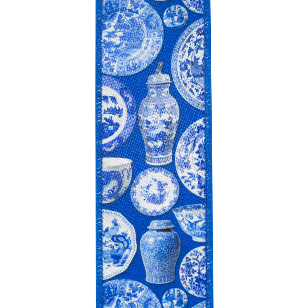Blue twill wired edge ribbon featuring a white chinoiserie pattern of ceramic plates and vases.