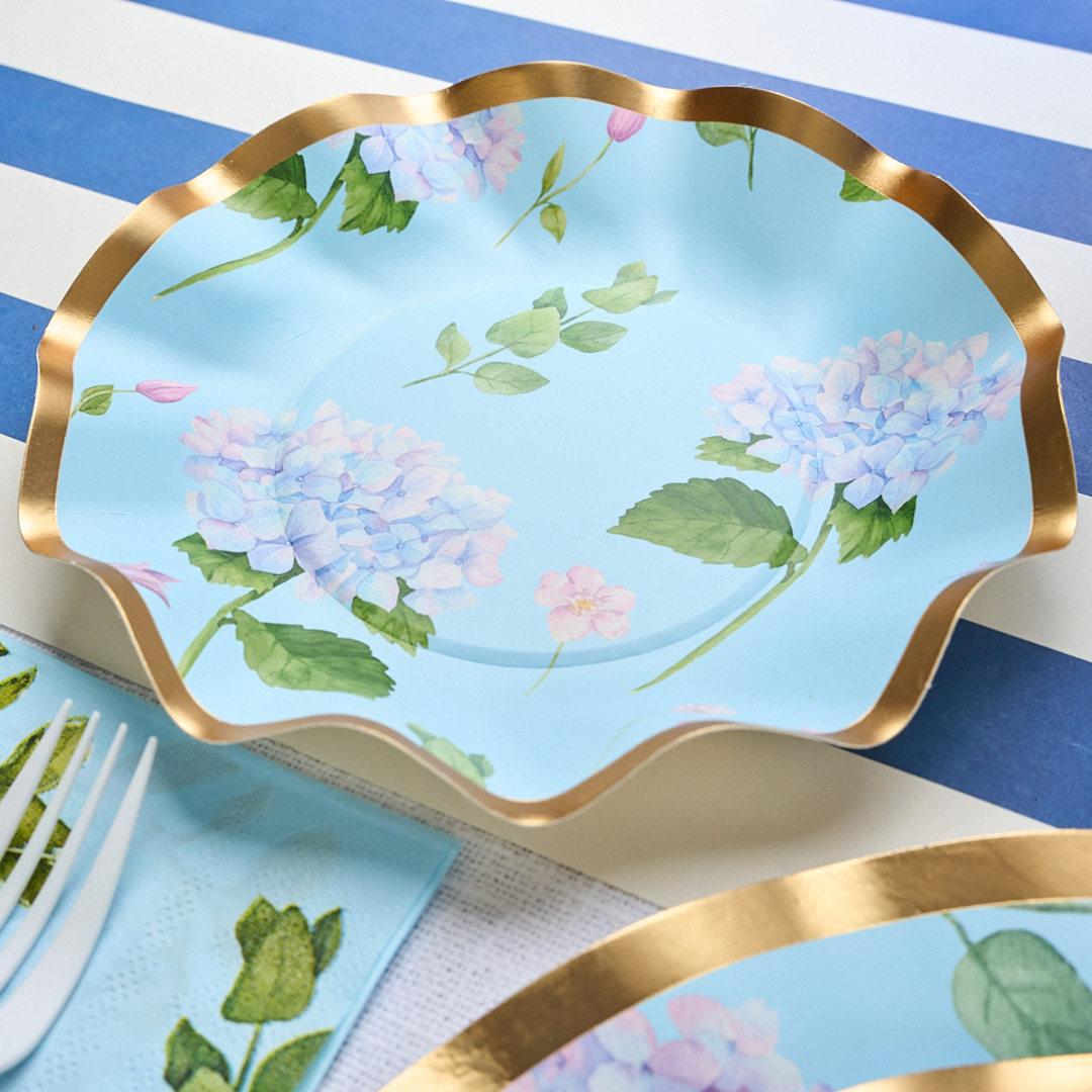 Blue paper appetizer bowl with gold foil trim and hydrangea flower pattern