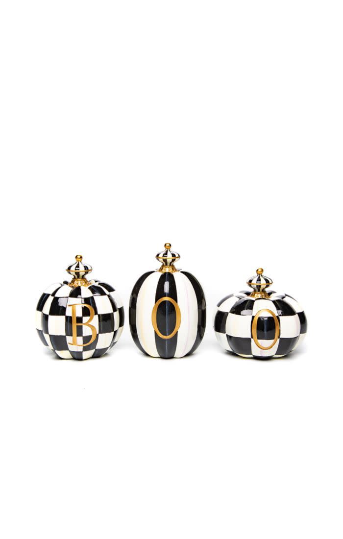 Set of three black and white patterned resin pumpkins spelling out BOO in gold letters.