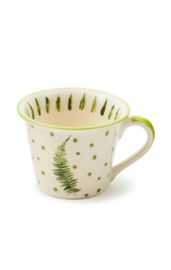 Fern Forest Mug with green fern leaf and polka dot pattern on a cream ceramic background.