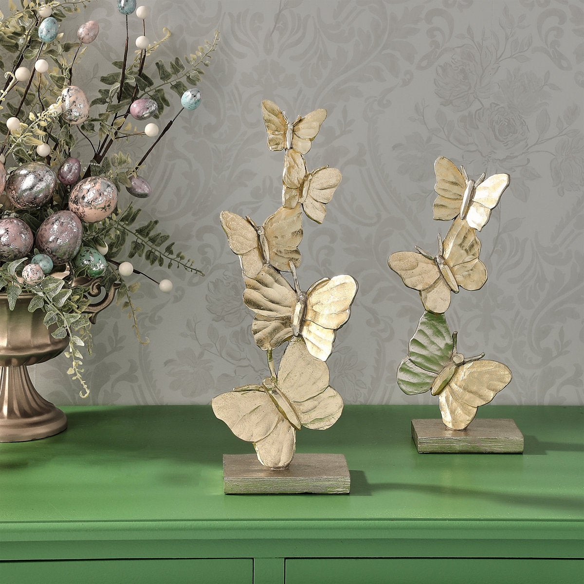 Resin butterfly figurine with delicate wings displayed on a stand.