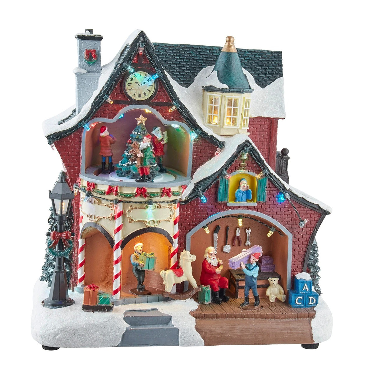 10.43" musical Christmas house with moving figures, LED lights, and Santa in his workshop.