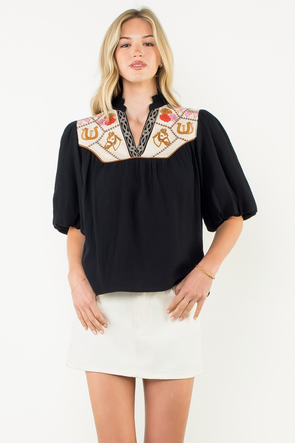 Women's white cotton top with puff sleeves and embroidered neckline