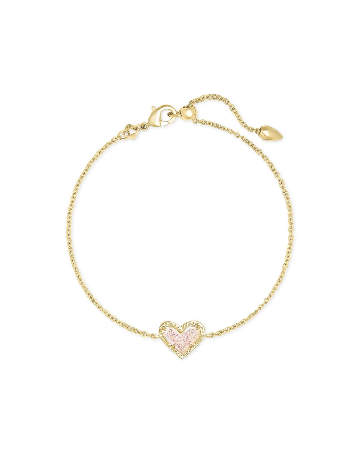 Rose quartz heart pendant on an adjustable yellow gold chain bracelet with asymmetrical silhouette.
