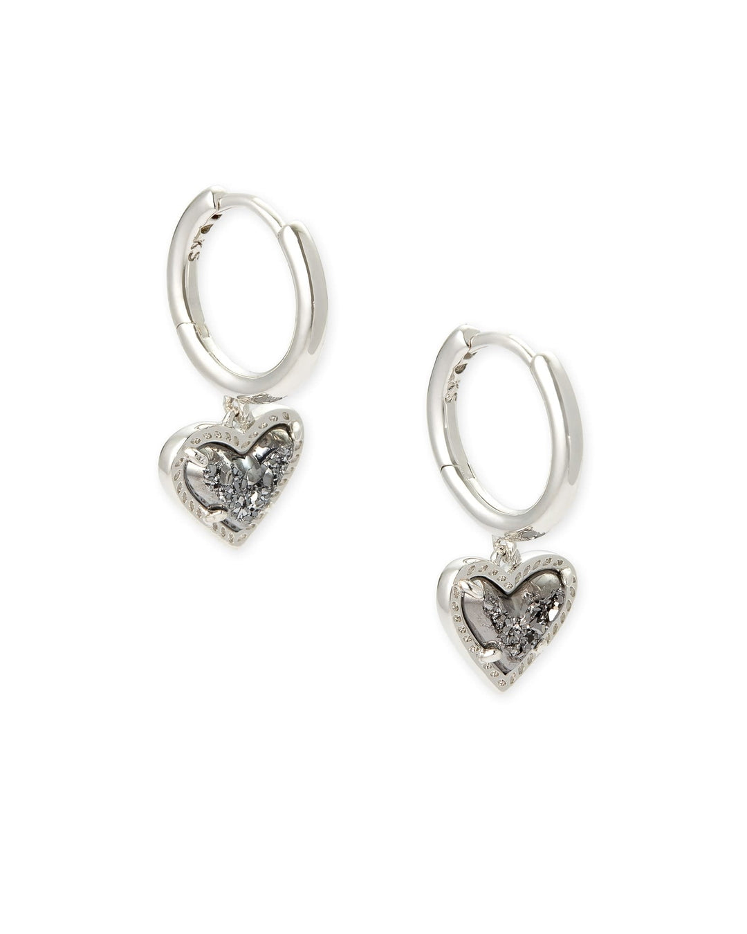 Silver huggie earrings featuring a platinum drusy heart charm with an asymmetrical hinge closure.