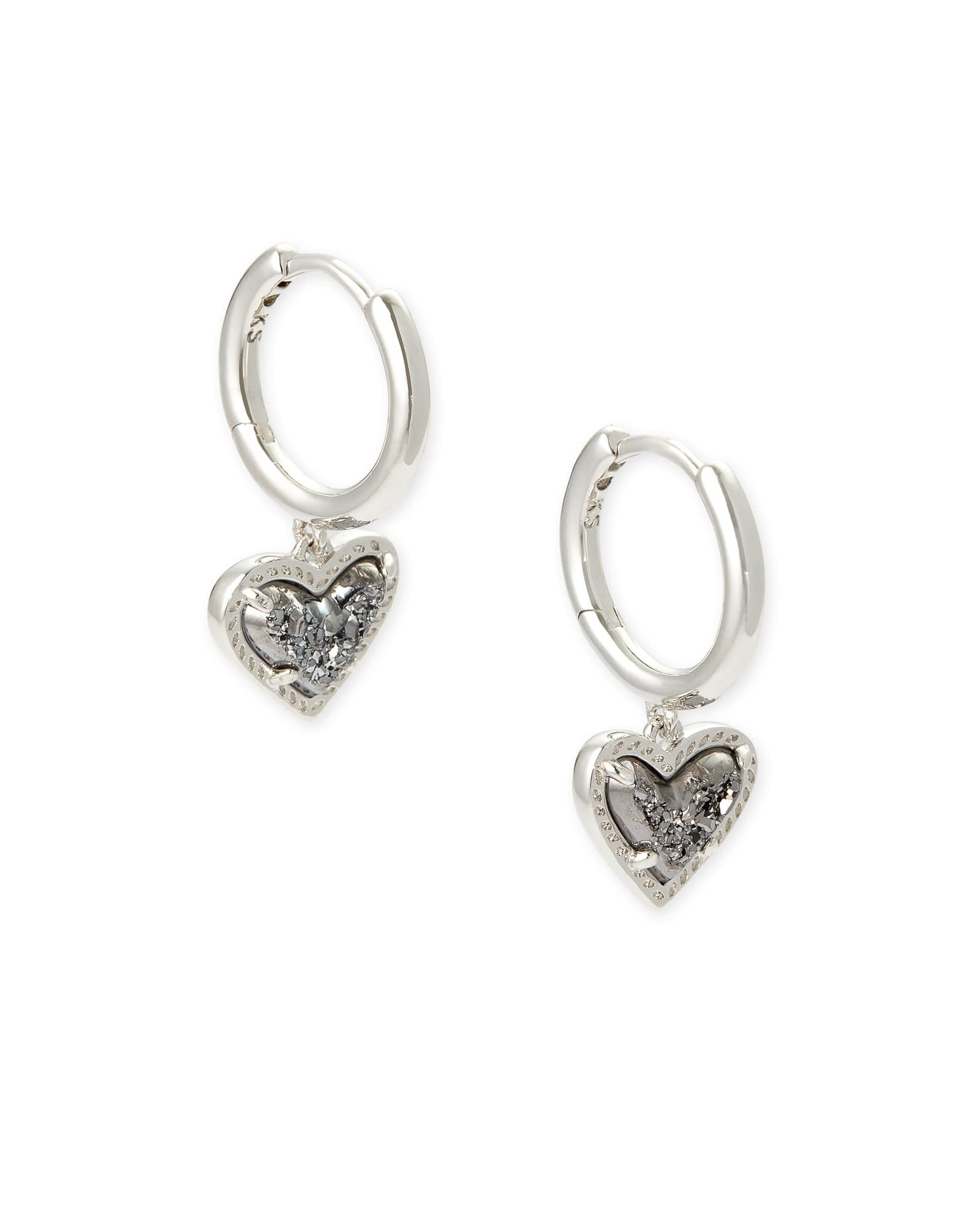 Silver huggie earrings featuring a platinum drusy heart charm with an asymmetrical hinge closure.