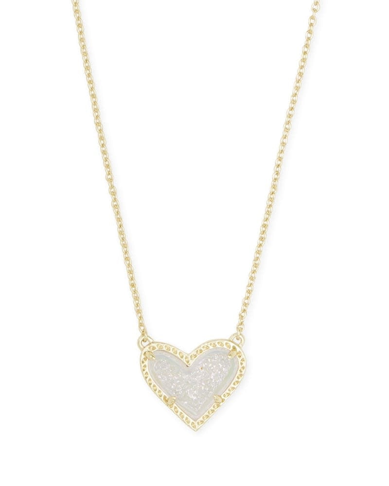 Gold iridescent Ari Heart short pendant necklace with asymmetrical heart shape on a chain.