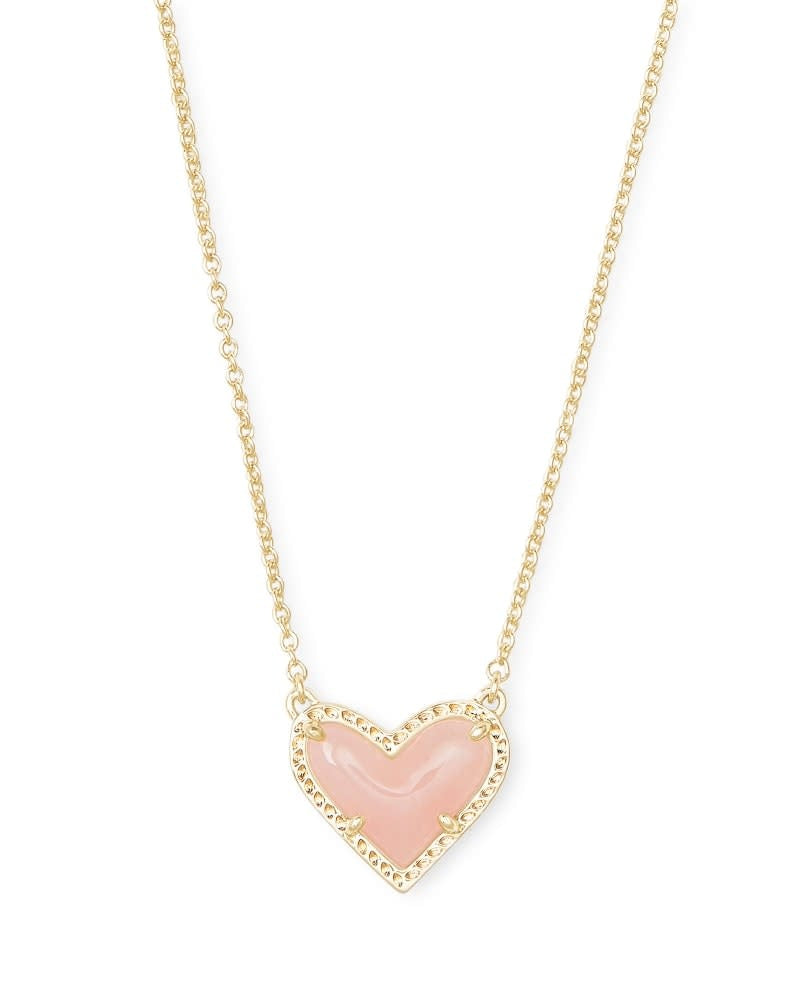 Rose quartz heart pendant necklace on a silver chain with lobster clasp closure