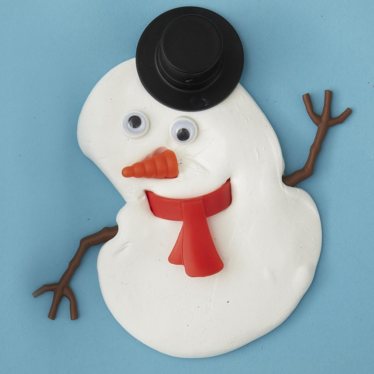 Miracle Melting Snowman with a black hat, googly eyes, carrot nose, red scarf, and stick arms.