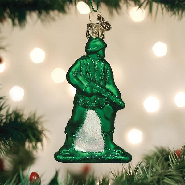 Army Man toy ornament with a standing soldier figure in green uniform holding a rifle.