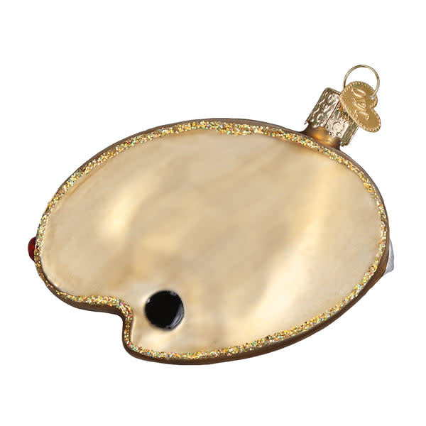 Glass ornament shaped like an artist's palette with a silver interior and hand-painted colorful lacquers.