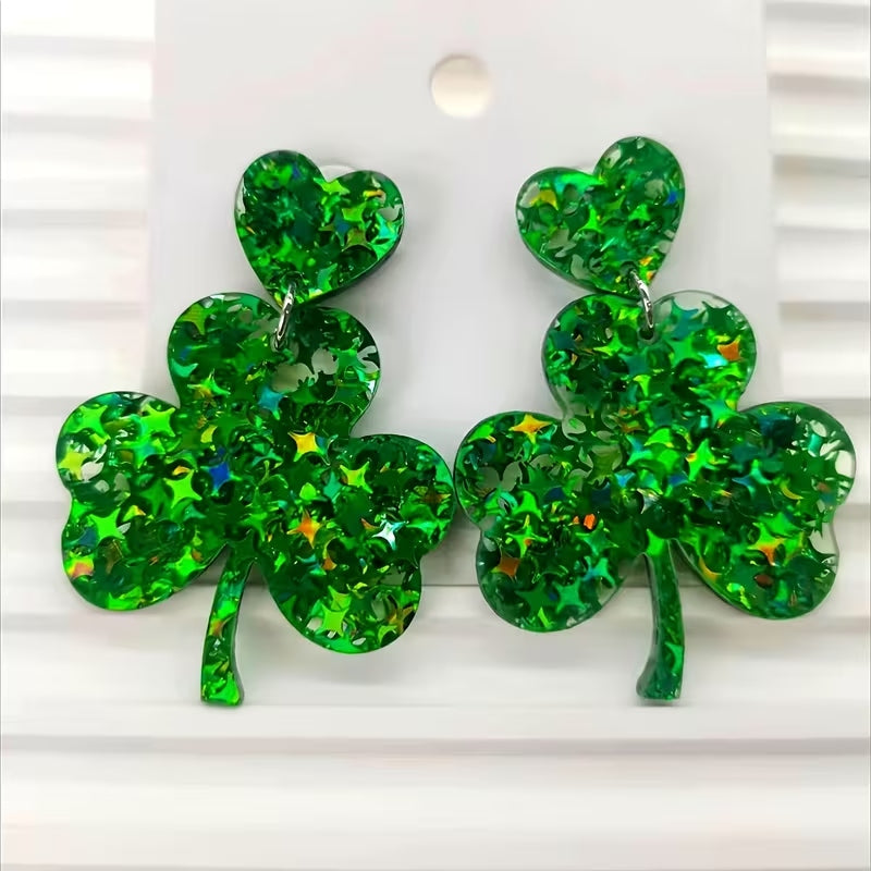 St. Patrick's Day green glitter clover dangle earrings with a leaf silhouette.