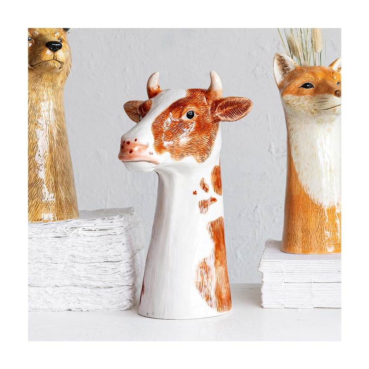 Round stoneware cow vase with hand-painted natural patterns.