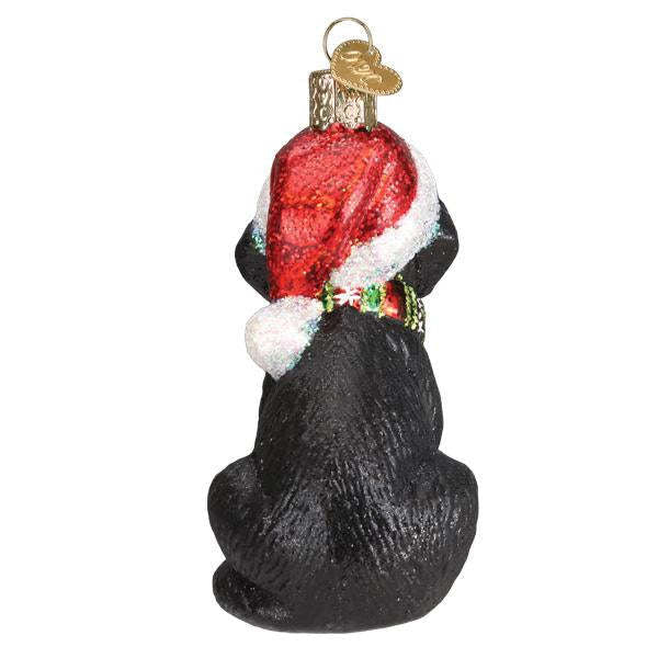 Black Labrador puppy ornament with glossy finish measuring 3.75 inches tall.