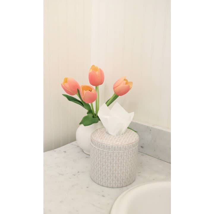 Ceramic tissue vessel with a square silhouette in neutral tones.