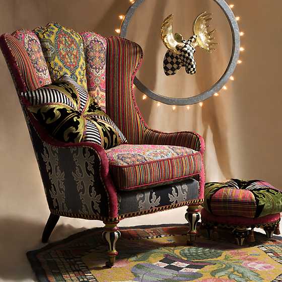 Courtly Check Small Moose head with gold antlers mounted inside a circular frame with lights.
