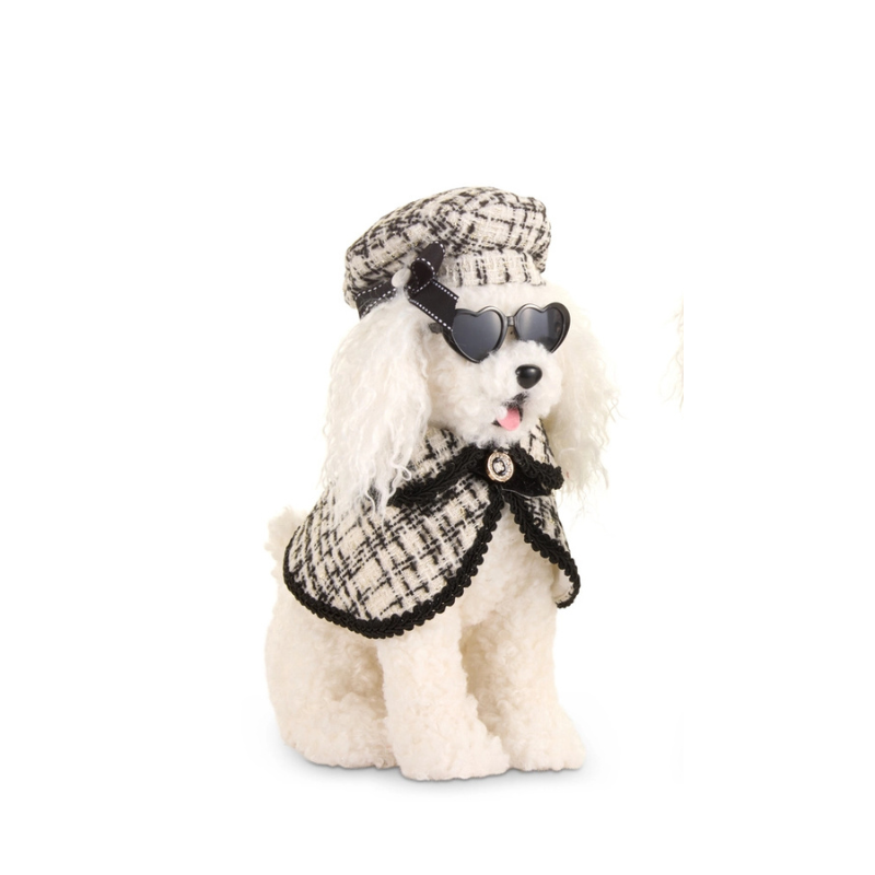 14-inch plush white poodle wearing a black and white tweed cape, matching beret, and sunglasses.