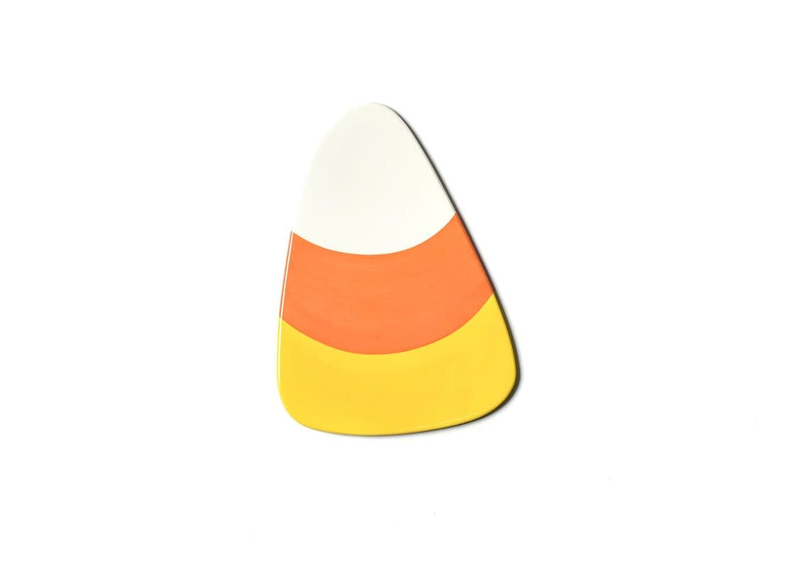 Ceramic wall hook with cheerful yellow circular shape featuring a dark geometric pattern.