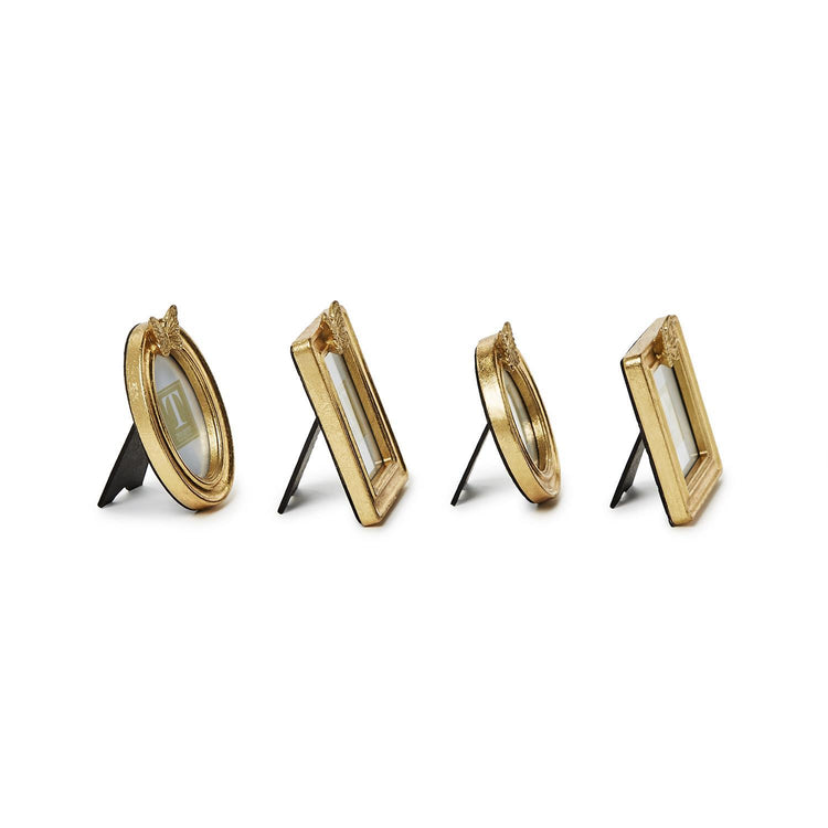Four small gold leaf finish photo frames in oval and rectangular shapes with butterfly accents.
