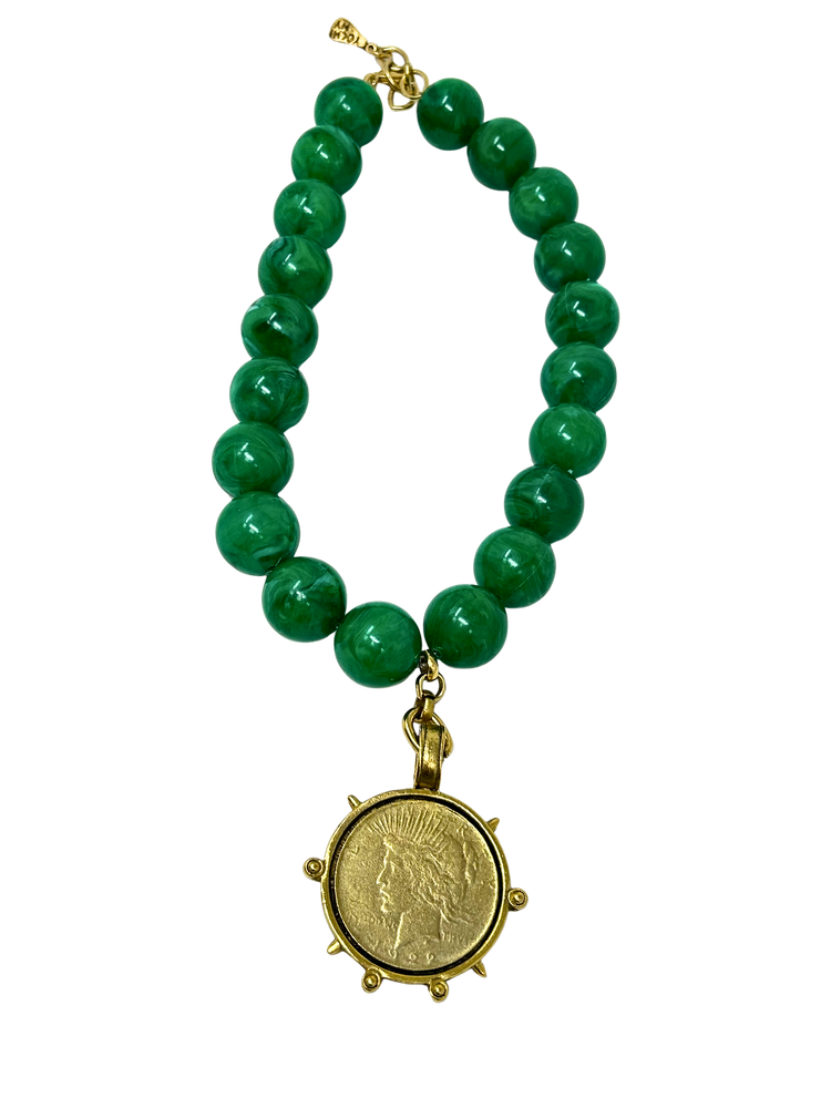 Vintage 18-inch necklace featuring green marbled beads and a gold-tone coin medallion pendant.