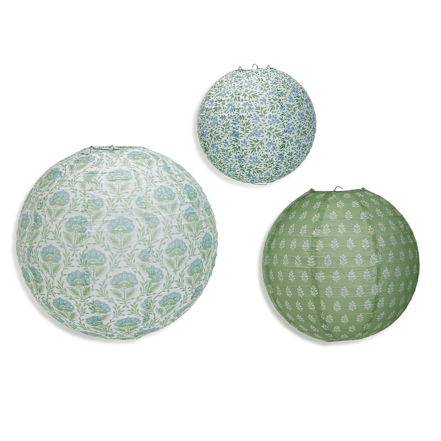 Set of white paper lanterns with a countryside-inspired rustic design.